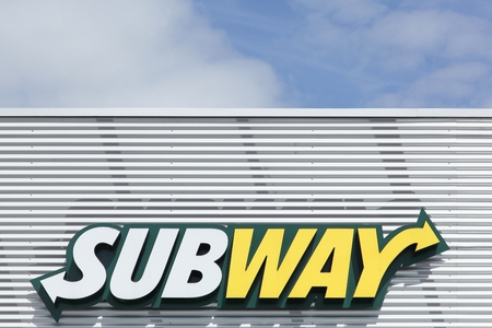 Bremen, Germany - July 31, 2015: Subway logo on a facade. Subway is an American fast food restaurant franchise that primarily sells submarine sandwiches and saladsのeditorial素材