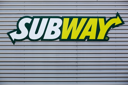 Villefranche sur Saone, France - May 24, 2015: Subway logo on a faade. Subway is an American fast food restaurant franchise that primarily sells submarine sandwiches and saladsのeditorial素材