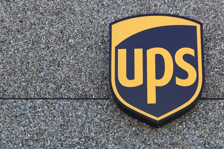 UPS logo on a facade. United Parcel Service is the worlds largest package delivery company and a provider of supply chain management solutions.のeditorial素材