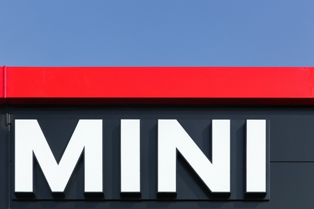 Villefranche, France - September 27, 2015: Mini logo was frontage of a dealer. Mini is a British automotive brand owned by BMW qui specialized in small cars.のeditorial素材
