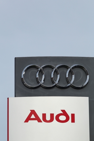 Aarhus, Denmark - September 10, 2015: Audi logo on a wall. Audi is a German automobile manufacturer that designs, engineers, produces, markets and distributes luxury automobilesのeditorial素材
