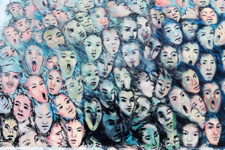 Berlin, Germany - February 13, 2013: Painting from Kani Alavi of differents faces at the East Side...
