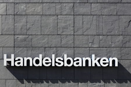 Aarhus, Denmark - May 1, 2016: Handelsbanken logo on a wall. Handelsbanken is a Swedish bank providing universal banking services and it is one of the major banks in Sweden with over 460 branchesのeditorial素材