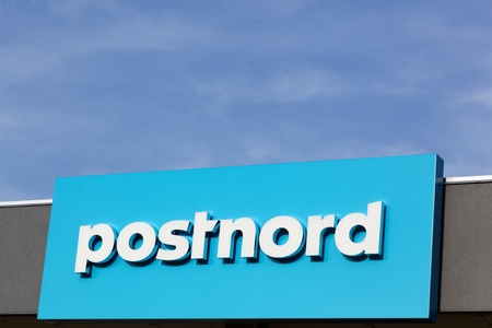 Esbjerg, Denmark - May 6, 2016: Postnord logo on a wall. PostNord is the name of the holding company of the two merged postal companies Posten AB and Post Danmark that were officially merged in 2009のeditorial素材