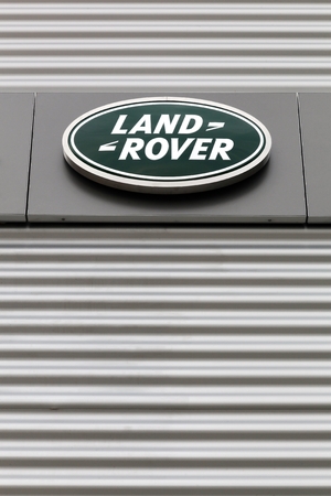Kolding, Denmark - May 29, 2016: Land Rover logo on a wall. Land Rover is a car brand that specialises in four-wheel-drive vehicles, owned by British multinational car manufacturer Jaguar Land Roverのeditorial素材