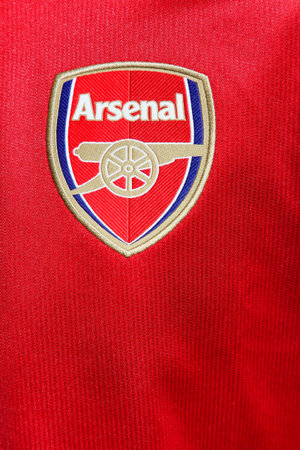 Odder, Denmark - August 8, 2017: Logo of Arsenal Football Club on a red Jersey. Arsenal Football Club is a professional football club based in London, England, that plays in the Premier Leagueのeditorial素材