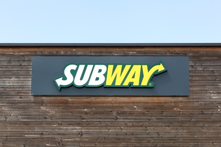 Cholet, France - June 25, 2016: Subway logo on a facade. Subway is an American fast food restaurant franchise that primarily sells submarine sandwiches and saladsのeditorial素材