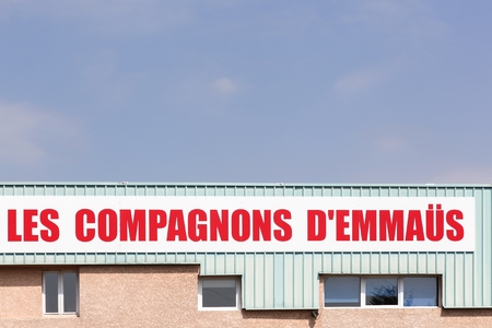 Sassenage, France - June 24, 2017: Companions Emmaus sign on a wall. Emmaus is an international solidarity movement founded in Paris in 1949 by the Catholic priest Abbe Pierreのeditorial素材