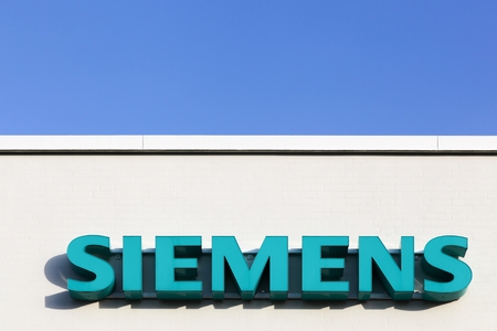 Tilst, Denmark - February 14, 2016: Siemens logo on a facade. Siemens is a german multinational. The principal divisions of the company are industry, energy, healthcare, infrastructure and citiesのeditorial素材