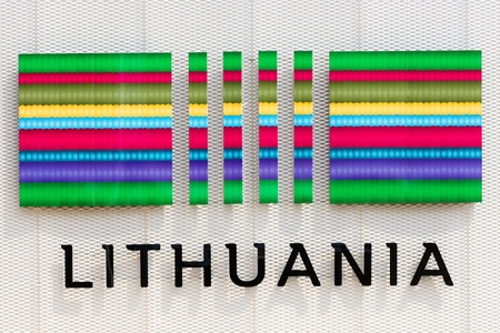 Lithuania flag and symbol on a wallの写真素材