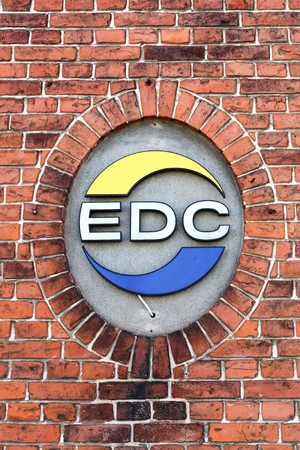 Odder, Denmark - April 2, 2018: EDC on a wall. EDC is Denmark's largest and oldest real estate chain formed in 1971 with 232 independent real estate agenciesのeditorial素材