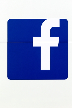 Holme, Denmark - June 23, 2018: Facebook logo on a wall. Facebook is an American online social media and social networking service company based in Menlo Park, Californiaのeditorial素材
