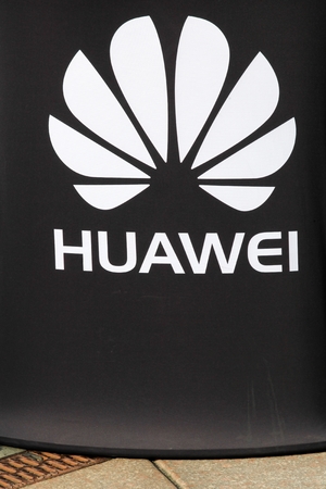 Vejle, Denmark - October 12, 2018: Huawei logo on a wall. Huawei is a Chinese multinational networking and telecommunications equipment and services company headquartered in Shenzhenのeditorial素材