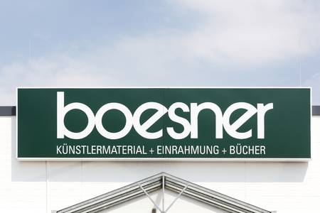 Munster, Germany - July 22, 2018: Boesner logo on a wall. Boesner is a wholesaler and retailer of professional artist materials, framing and art booksのeditorial素材