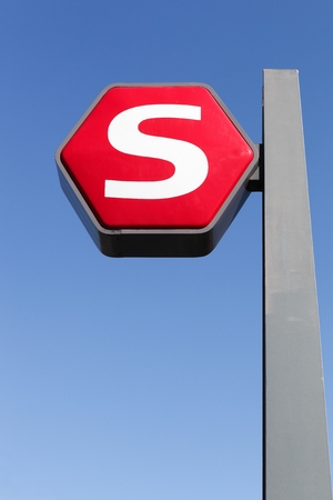 Copenhagen, Denmark - April 2, 2019: The Copenhagen S-train sign on a pole. The S-train of Copenhagen in Denmark is a hybrid urban-suburban rail serving the the Copenhagen urban areaのeditorial素材