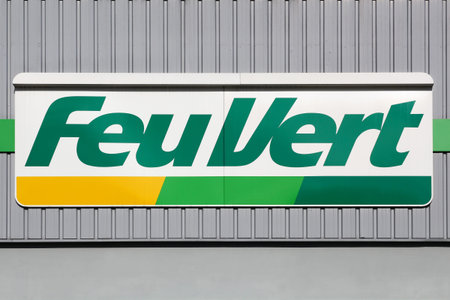 Grenoble, France - June 16, 2019: Feu Vert logo on a wall. Feu vert is a French company specialized...