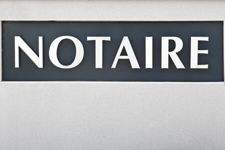 Sign of notary on a wall in Franceの写真素材