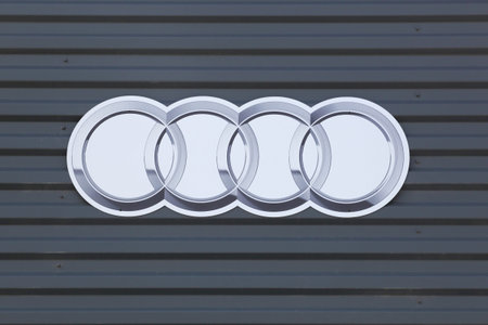 Grenoble, France - June 16, 2019: Audi logo on a wall. Audi is a German automobile manufacturer that...