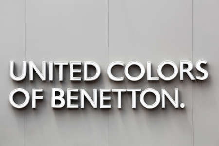 Tassin, France - June 28, 2020: United colors of Benetton logo on a wall. Benetton Group is a global fashion brand based in Ponzano Veneto, Italy founded in 1965のeditorial素材