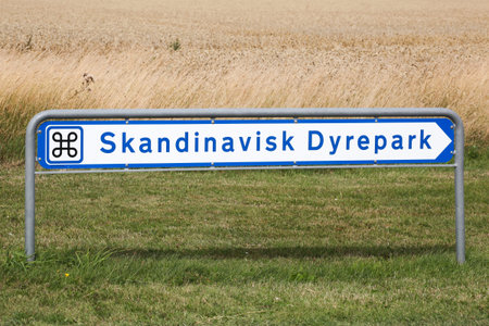 Kolind, Denmark - August 6, 2020: Scandinavian wildlife park road sign called Skandinavisk Dyrepark...