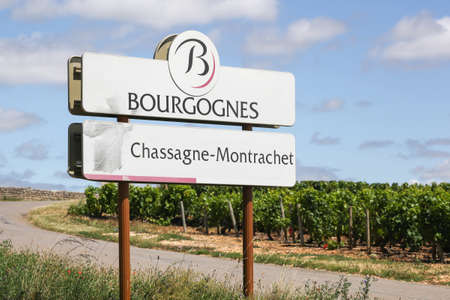 Chassagne-Montrachet, France - July 5, 2020: Road sign Chassagne-Montrachet, wine of Burgundy, Franceのeditorial素材
