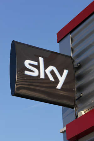 Bremen, Germany - September 1, 2018: Sky logo on a signboard. Sky UK is a British broadcaster and telecommunications company that provides television and broadband Internet servicesのeditorial素材