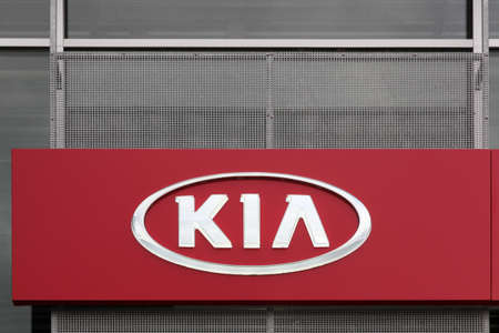 Silkeborg, Denmark - April 9, 2016: Kia Motors logo on a wall of a dealership. Kia Motors Corporation headquartered in Seoul, is South Korea's second largest automobile manufacturerのeditorial素材
