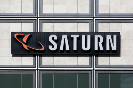 Berlin, Germany - July 12, 2020: Saturn store logo on a wall. Saturn is a German chain of...