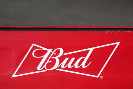 Oingt, France - October 19, 2020: Budweiser logo on a wall. Budweiser is an American-style pale lager produced by Anheuser-Busch, part of AB InBevのeditorial素材