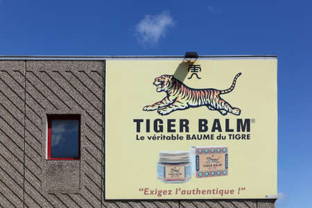 Anse, France - June 14, 2020: Tiger Balm logo on a wall. Tiger Balm is an ointment from the Chinese pharmacopoeia. It is a product for external use, used to relieve pain of musculoskeletal originのeditorial素材