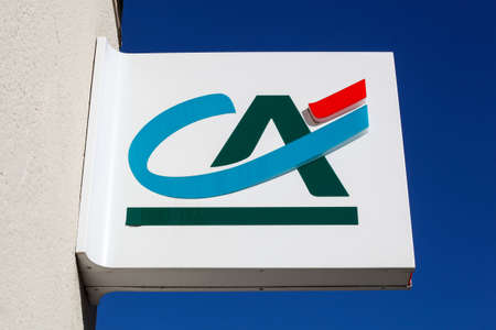 Ecully , France - June 13, 2021: Credit Agricole logo on a wall. Credit Agricole is a French network of cooperative and mutual banks comprising the 39 Credit Agricole Regional Bankのeditorial素材