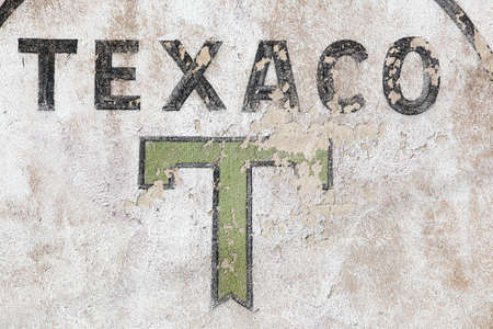 Beaujeu, France - July 8, 2020: Retro Texaco logo on a wall. Texaco is an American oil subsidiary of Chevron Corporationのeditorial素材
