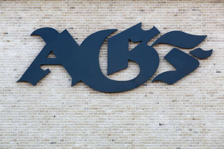 Aarhus, Denmark - March 13, 2022: Aarhus AGF logo on a wall. Aarhus AGF is a professional Danish football club currently playing in superligaのeditorial素材