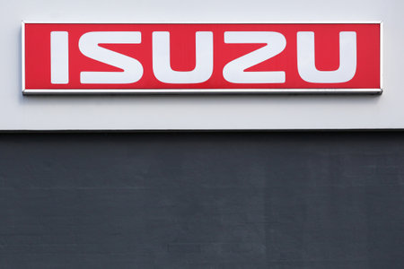 Aalborg, Denmark - May 21, 2022: Isuzu logo on a wall. Isuzu is a Japanese multinational automobile manufacturer headquartered in Nishi-ku, Yokohama, Japanのeditorial素材