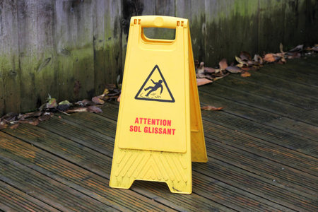 Caution slippery floor surface sign called caution slippery floor in french language
