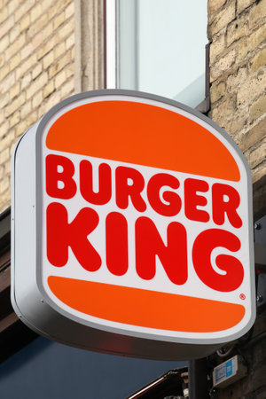 Aarhus, Denmark - March 4, 2022: Burger King logo on a wall. Burger King is a global chain of hamburger fast food restaurantsのeditorial素材