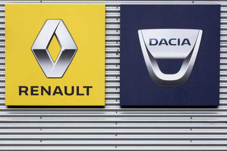 Risskov, Denmark - July 25, 2020: Renault and Dacia logos on a wall. The romanian car manufacturer Dacia was acquired by the renault group in 1999のeditorial素材