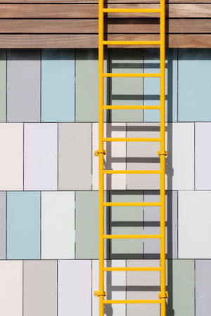 Yellow ladder on a wall