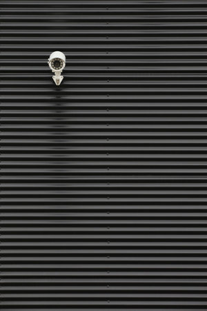 Black corrugated metal sheet texture useful as a background - Vertical
