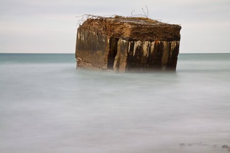 A bunker on the shore of the Baltic Sea.の写真素材