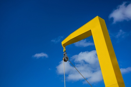 A yellow crane with blue sky の写真素材