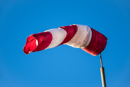 A windsock with blue sky の写真素材