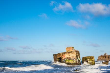 Bunker on shore of the Baltic Sea on a stormy day.の写真素材