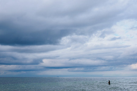 Angler on shore of the Baltic Sea.