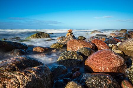 Stones on shore of the Baltic Sea near Warnemuende, Germany.の写真素材