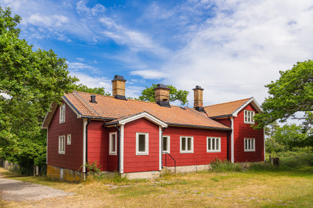 Red wooden house on the island Ãland in Sweden.の写真素材