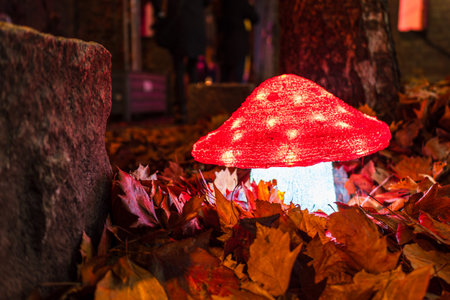 Mushroom shaped lighting and autumn leaves on the roadside in Rostock, Germany.の写真素材