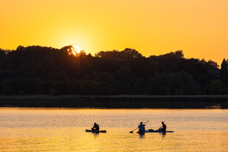 Surf paddler on the river Warnow in the Hanseatic City of Rostock, Germany.の写真素材