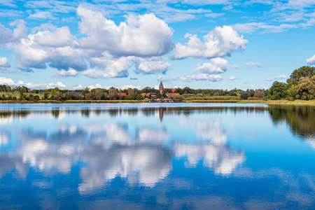 Reflection of clouds on Krakow Lake in the village of Serrahn, Germany.の写真素材