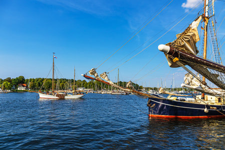 Sailing ships on the river Warnow during the Hanse Sail in Rostock, Germany.